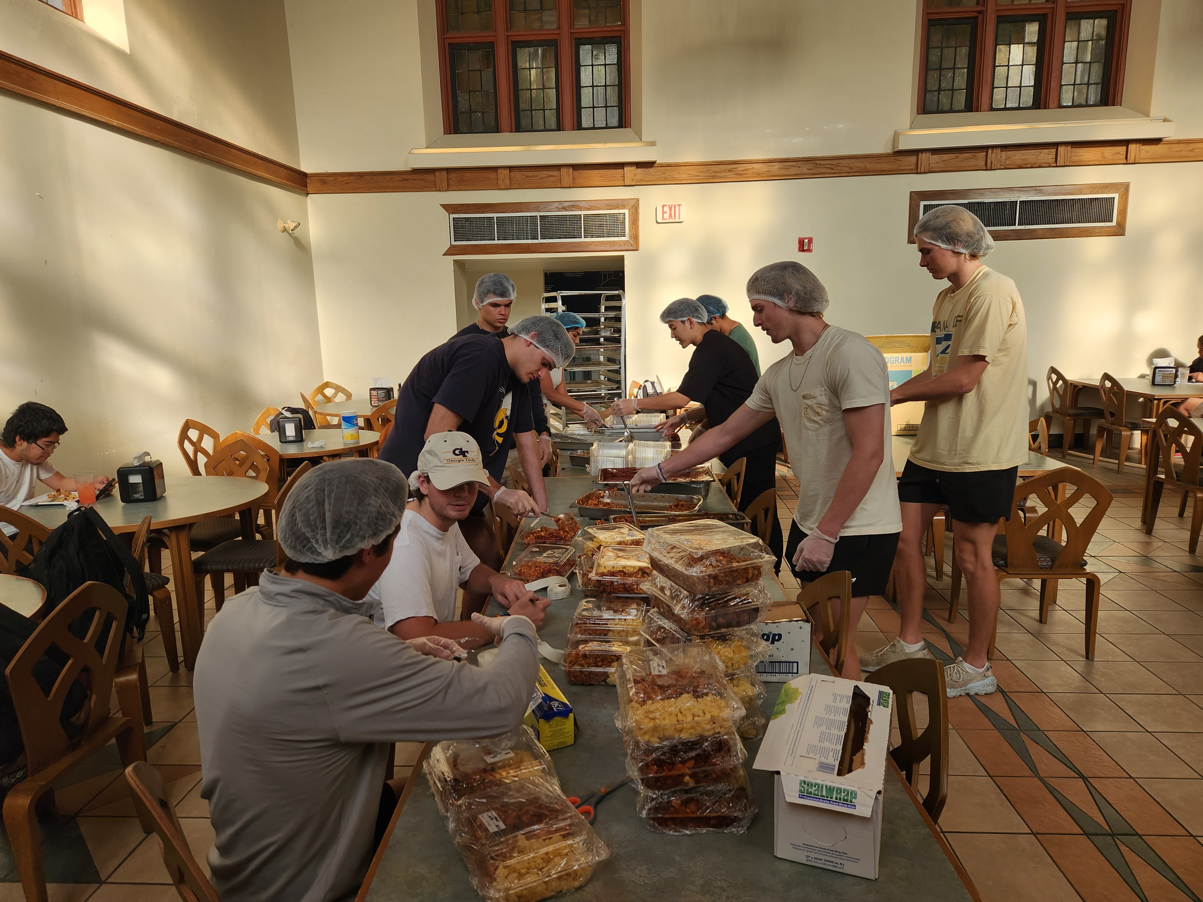 volunteers packaging food